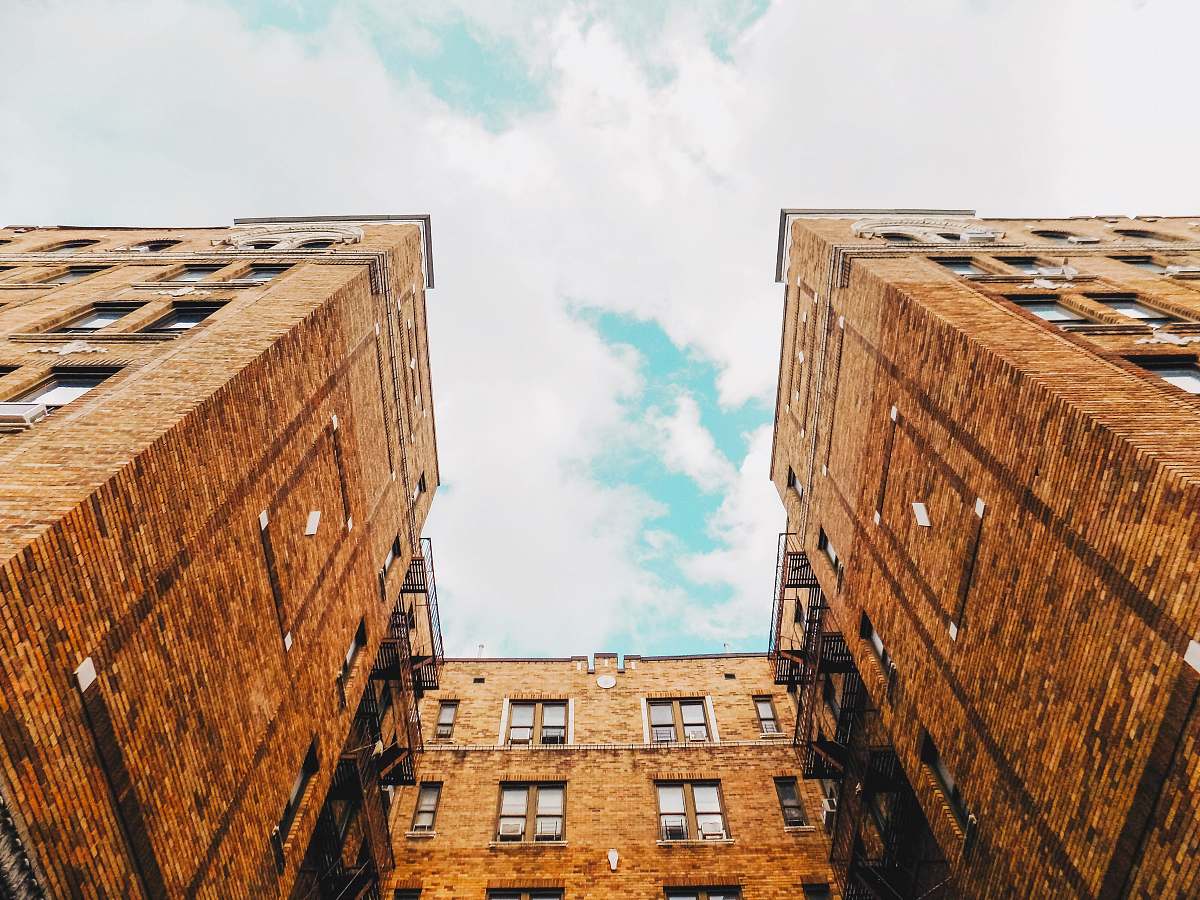 brooklyn low angle photography of brown high-rise building brick